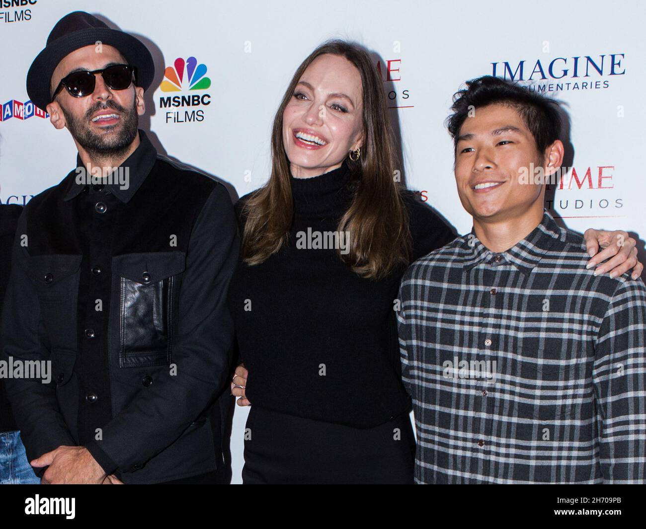 Los Angeles, United States. 18th Nov, 2021. LOS ANGELES, CALIFORNIA, USA - NOVEMBER 18: Street artist JR, actress Angelina Jolie and Pax Thien Jolie-Pitt arrive at the Los Angeles Premiere Of MSNBC Films' 'Paper & Glue: A JR Project' held at the Museum Of Tolerance on November 18, 2021 in Los Angeles, California, United States. (Photo by Rudy Torres/Image Press Agency) Credit: Image Press Agency/Alamy Live News Stock Photo