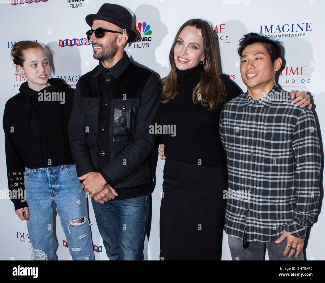 Los Angeles, United States. 18th Nov, 2021. LOS ANGELES, CALIFORNIA, USA - NOVEMBER 18: Shiloh Jolie-Pitt, street artist JR, actress Angelina Jolie and Pax Thien Jolie-Pitt arrive at the Los Angeles Premiere Of MSNBC Films' 'Paper & Glue: A JR Project' held at the Museum Of Tolerance on November 18, 2021 in Los Angeles, California, United States. (Photo by Rudy Torres/Image Press Agency/Sipa USA) Credit: Sipa USA/Alamy Live News Stock Photo