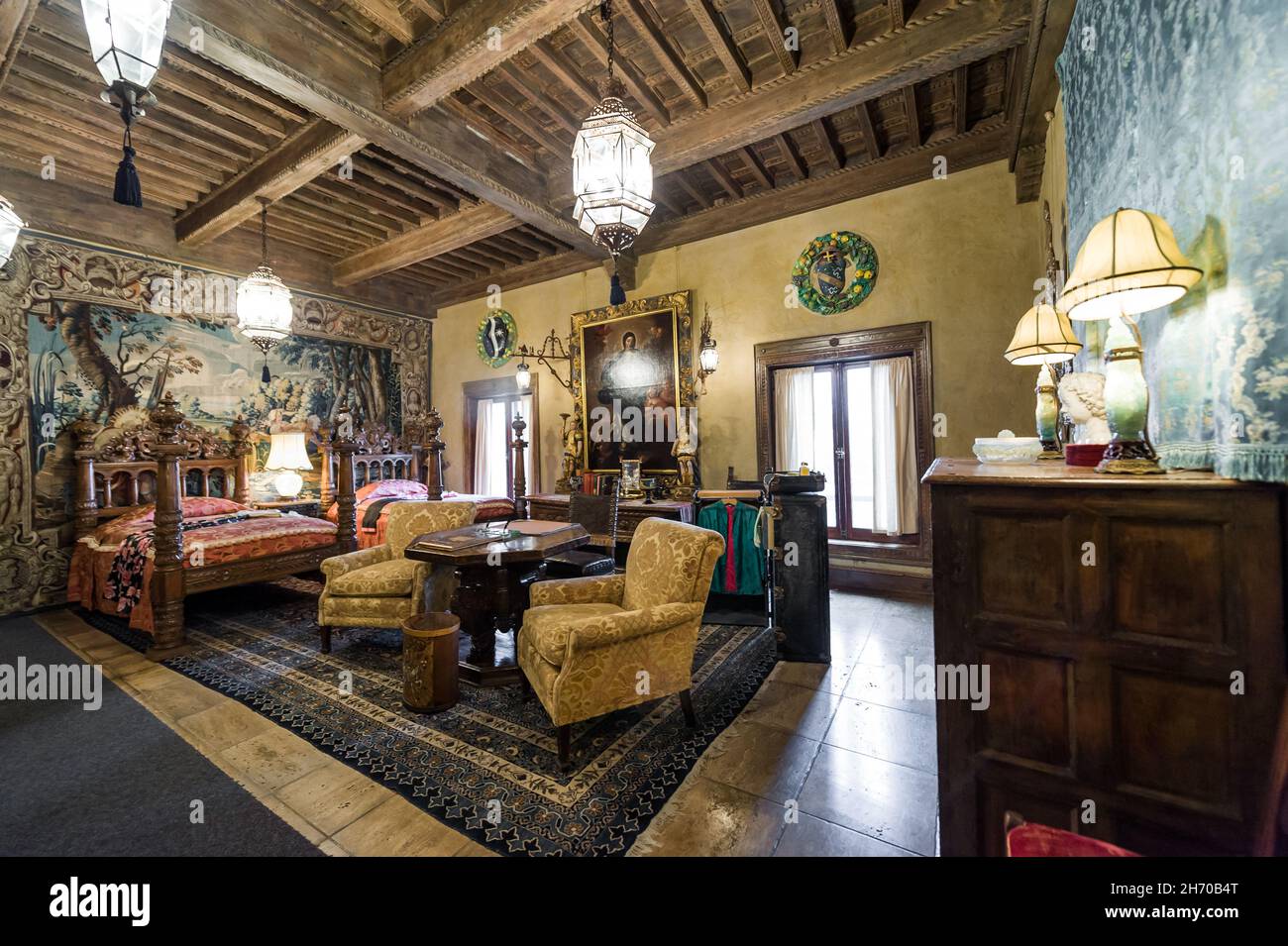 California, USA, 09 Jun 2013: Spacious double bed room at Hearst Castle, which is a National and California Historical Landmark opened for public tour Stock Photo