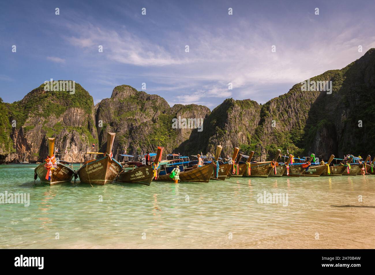 Krabi, Thailand, 19 Nov 2013: Long tail boat anchored at Maya Bay at famous tourist destination Phi Phi Island. Stock Photo