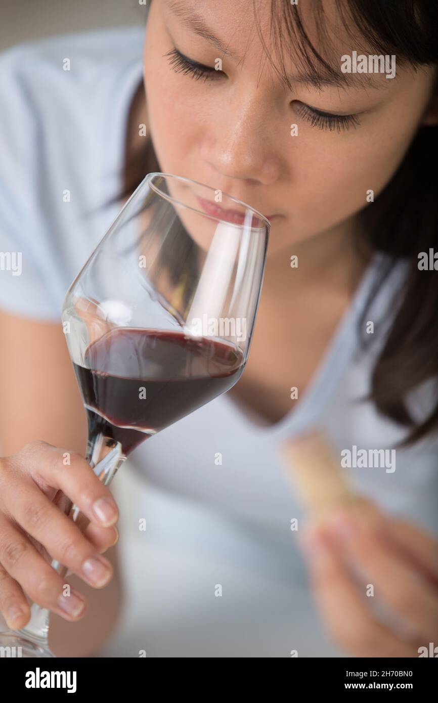closeup portrait of young woman drinking red wine Stock Photo