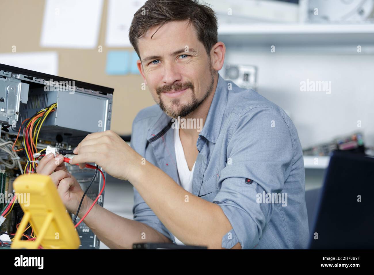 happy computer repair technician repairing hardware Stock Photo Alamy
