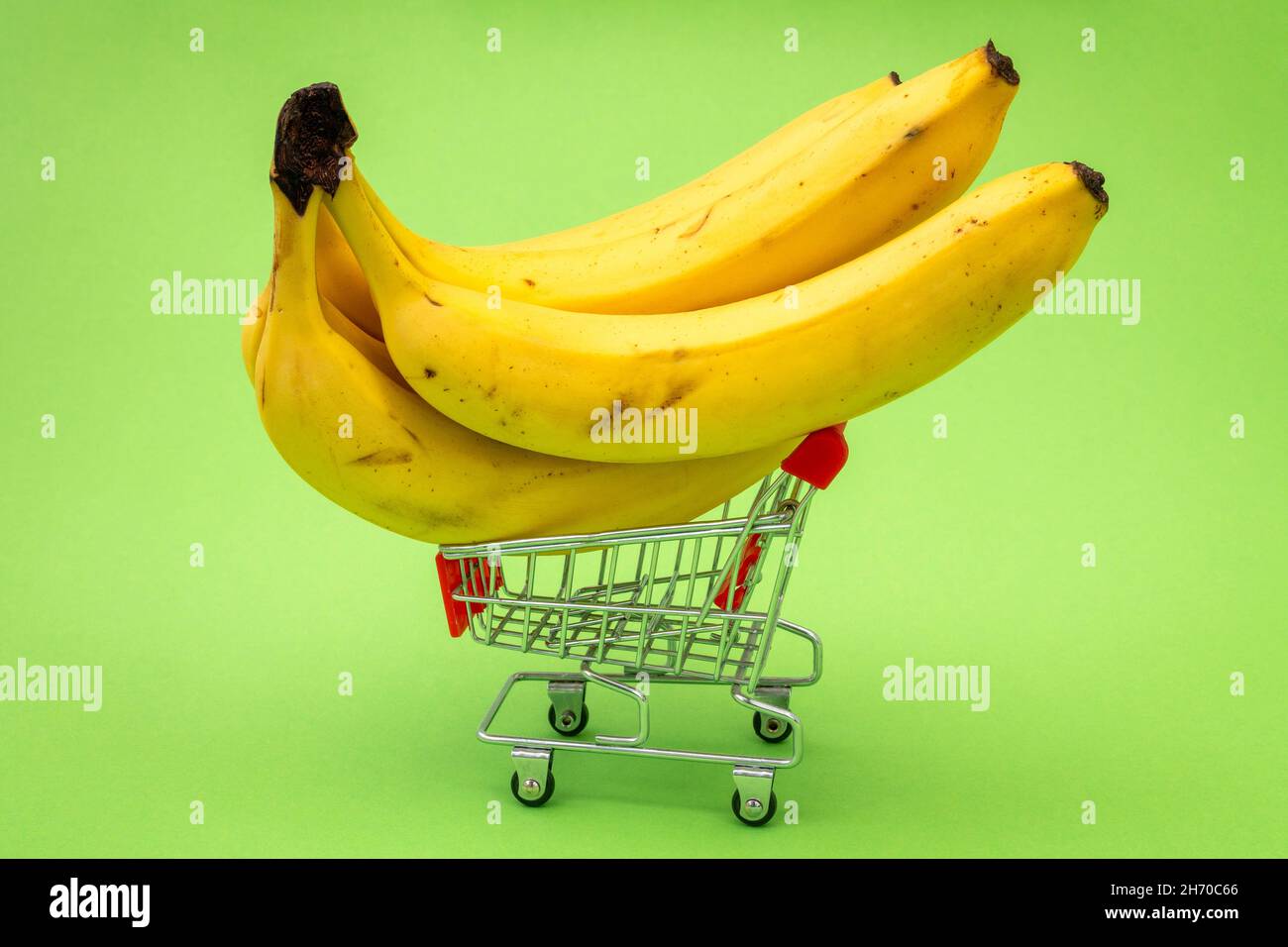 Grocery shopping cart concept. Shopping trolley full of bananas on