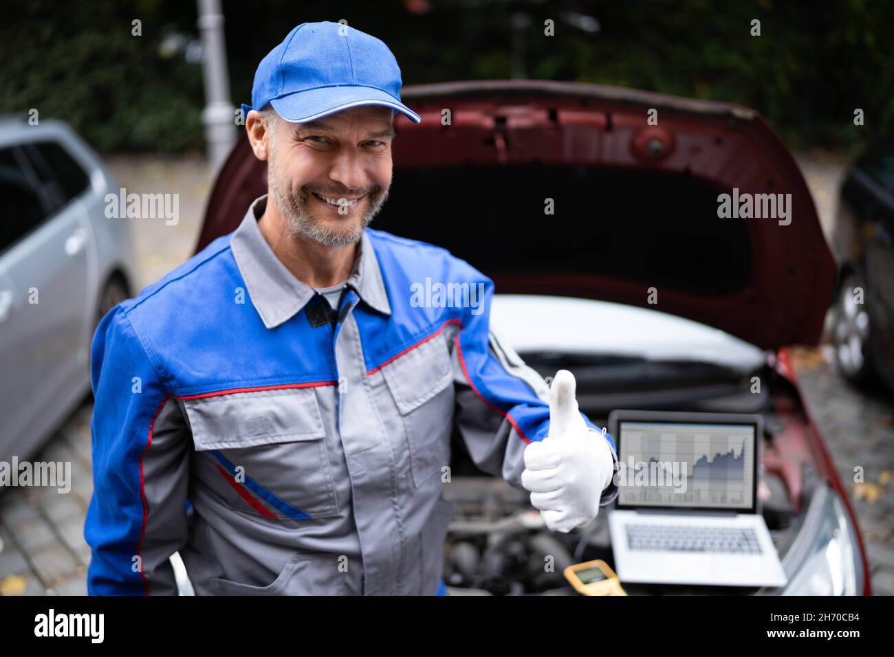 Car Diagnostic Service And Electronics Repair By Mechanic Worker Stock
