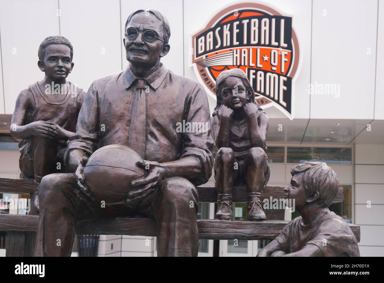 A sculpture, statue of the inventor of basketball, Dr James Naismith. Out front at the NBA Basketball Hall Of Fame Museum. In Springfield, Massachuset Stock Photo