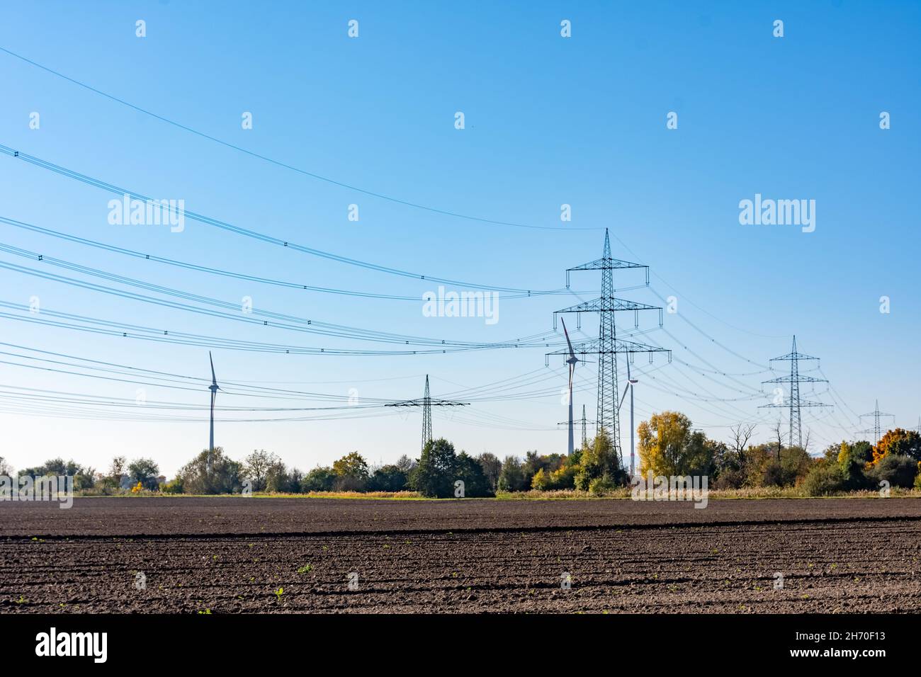 Closeup of power transmission lines in the farm field Stock Photo - Alamy