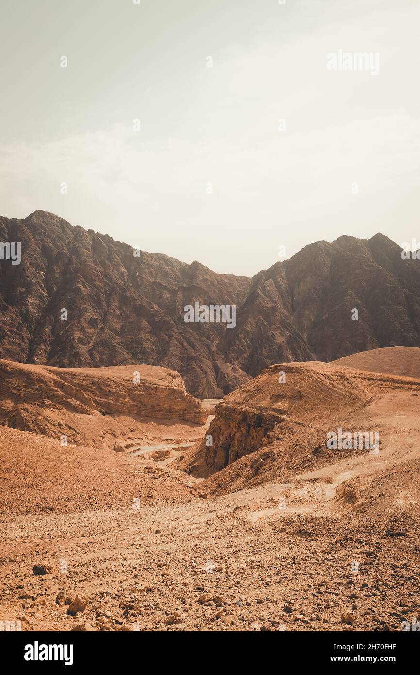 Vertical shot of a landscape with rocks and desert Stock Photo - Alamy
