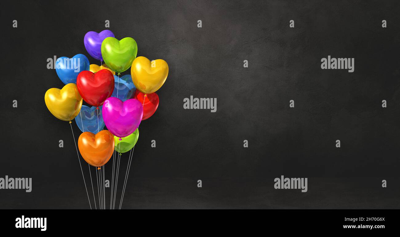Colorful heart shape balloons bunch on a black wall background ...