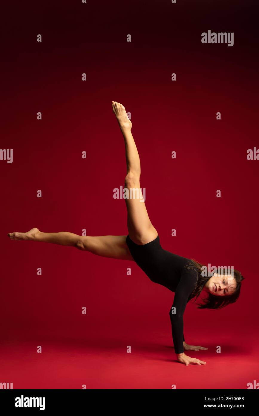 Studio shot of young flexible girl, female contemp dancer, ballerina in ...