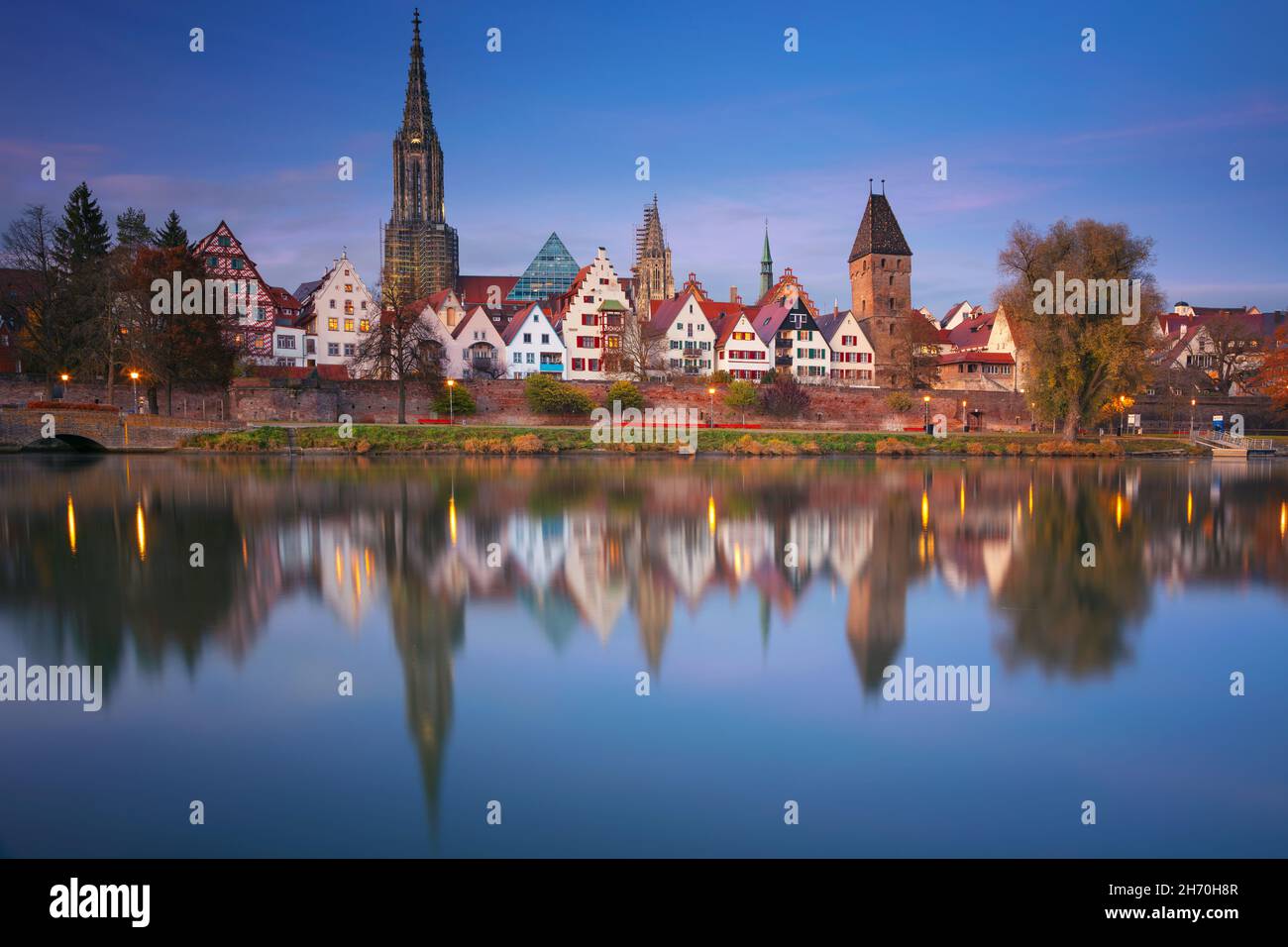 Ulm, German. Cityscape image of old town Ulm, Germany with the Ulm Minster, tallest church in the world and reflection of the city in Danube River at Stock Photo
