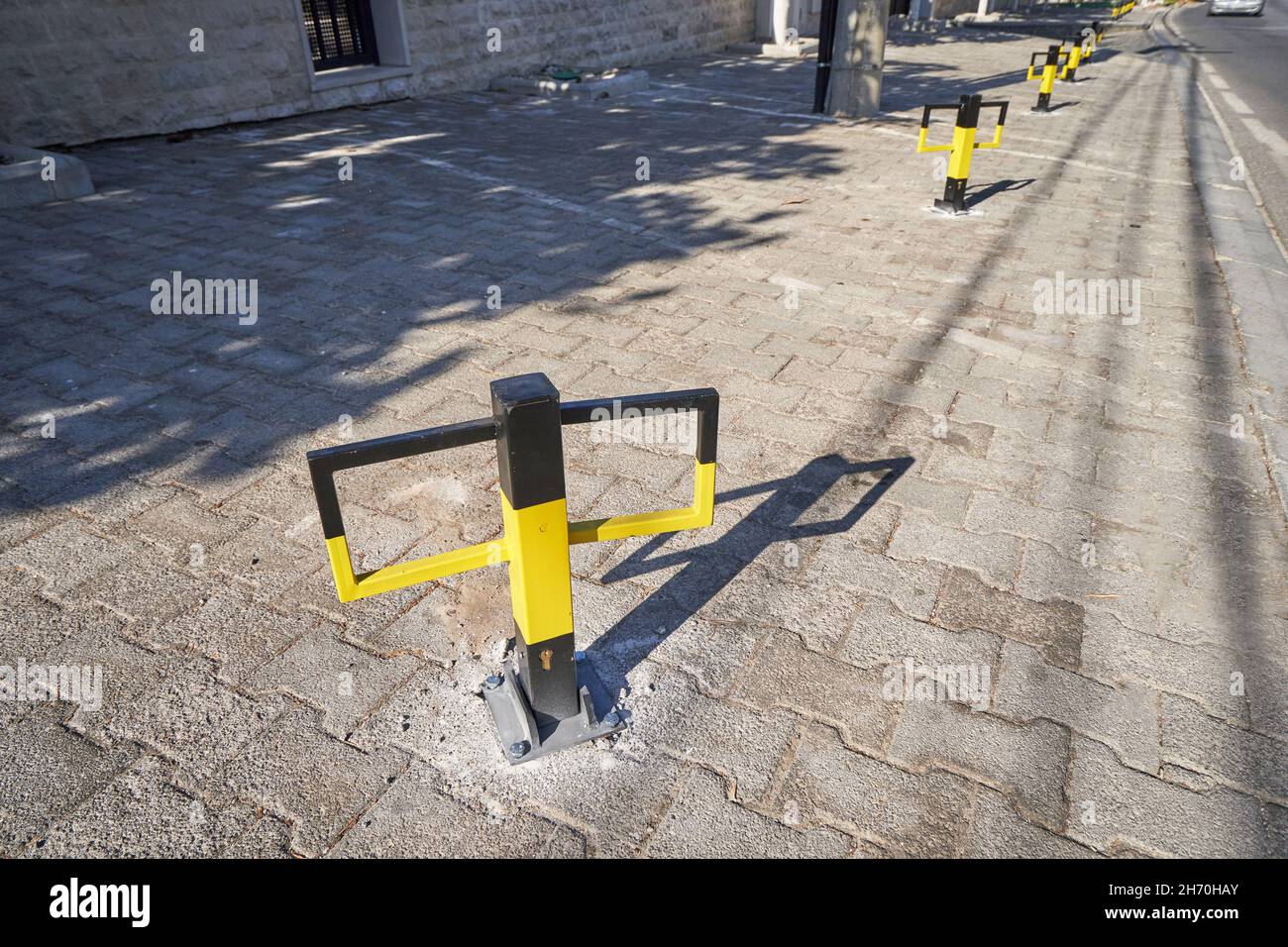 Parking restrictor or barrier to reserve a free space Stock Photo - Alamy
