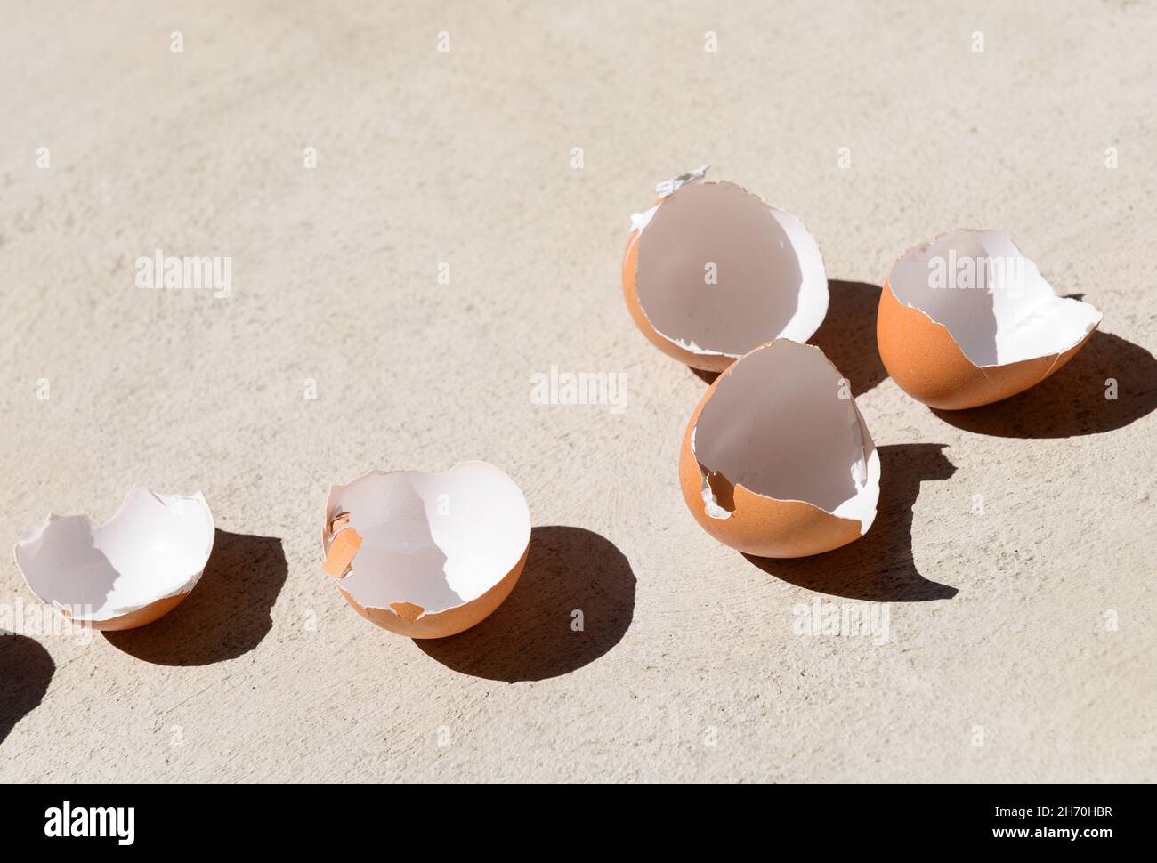 Cracked chicken egg shells background Stock Photo