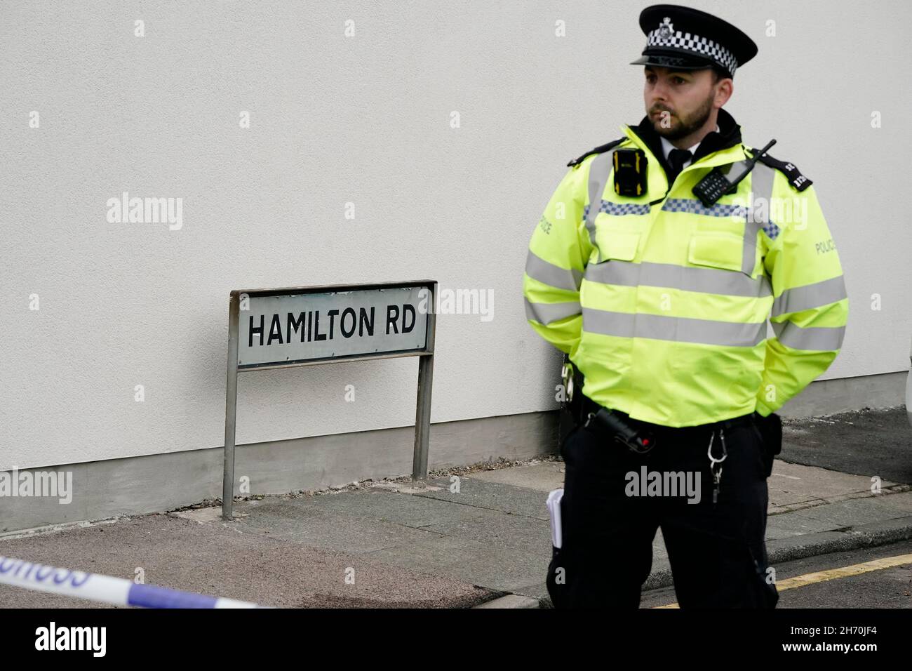 A Metropolitan Police officer at the scene of a house fire on Hamilton