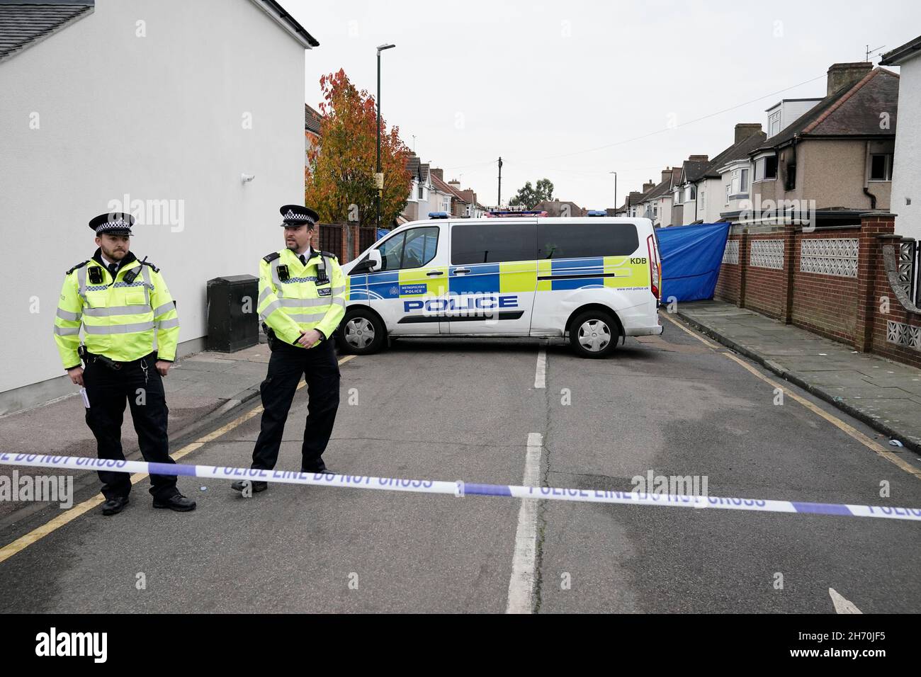 Metropolitan Police officers at the scene of a house fire on Hamilton