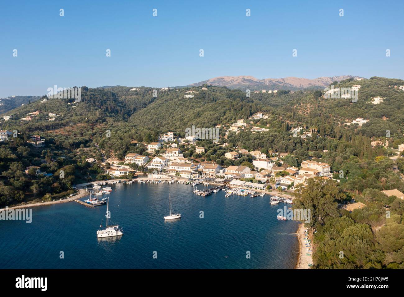 Aerial view of Agios Stefanos - a seafront fishing village, and popular tourist destination, on the northeast coast of Corfu, Ionian Islands, Greece Stock Photo