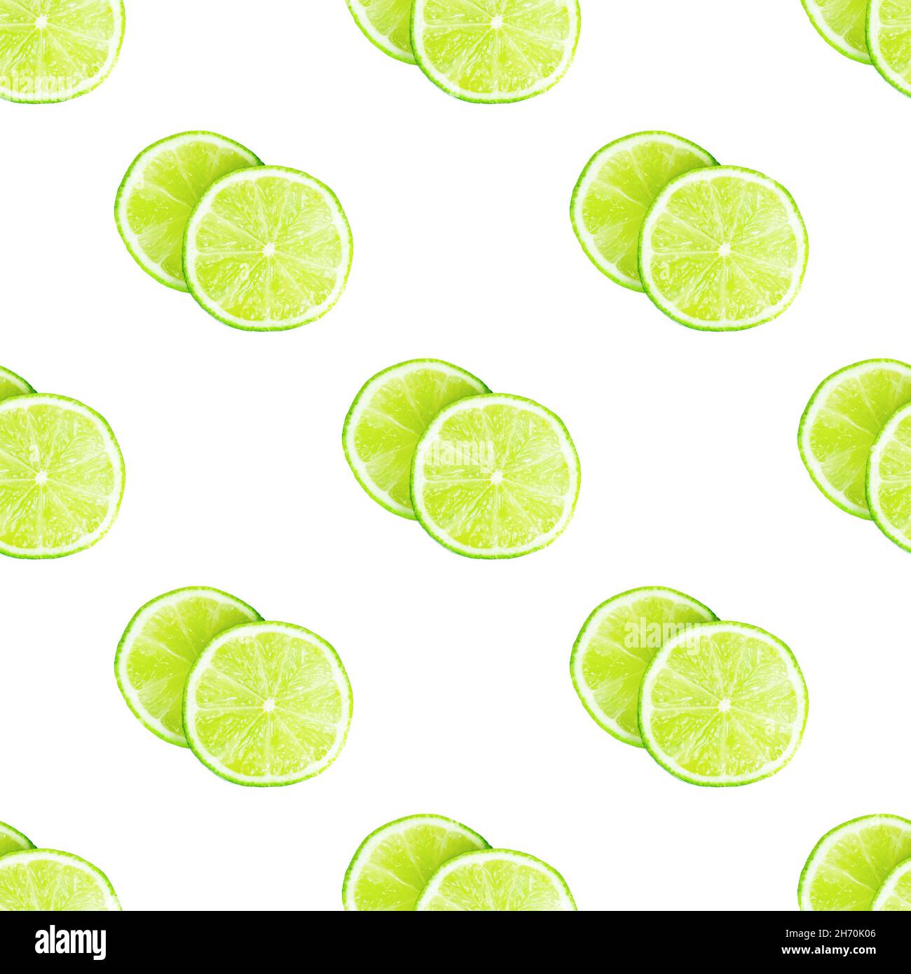 Green limes and lime slices repeat seamless pattern on white background. Stock Photo