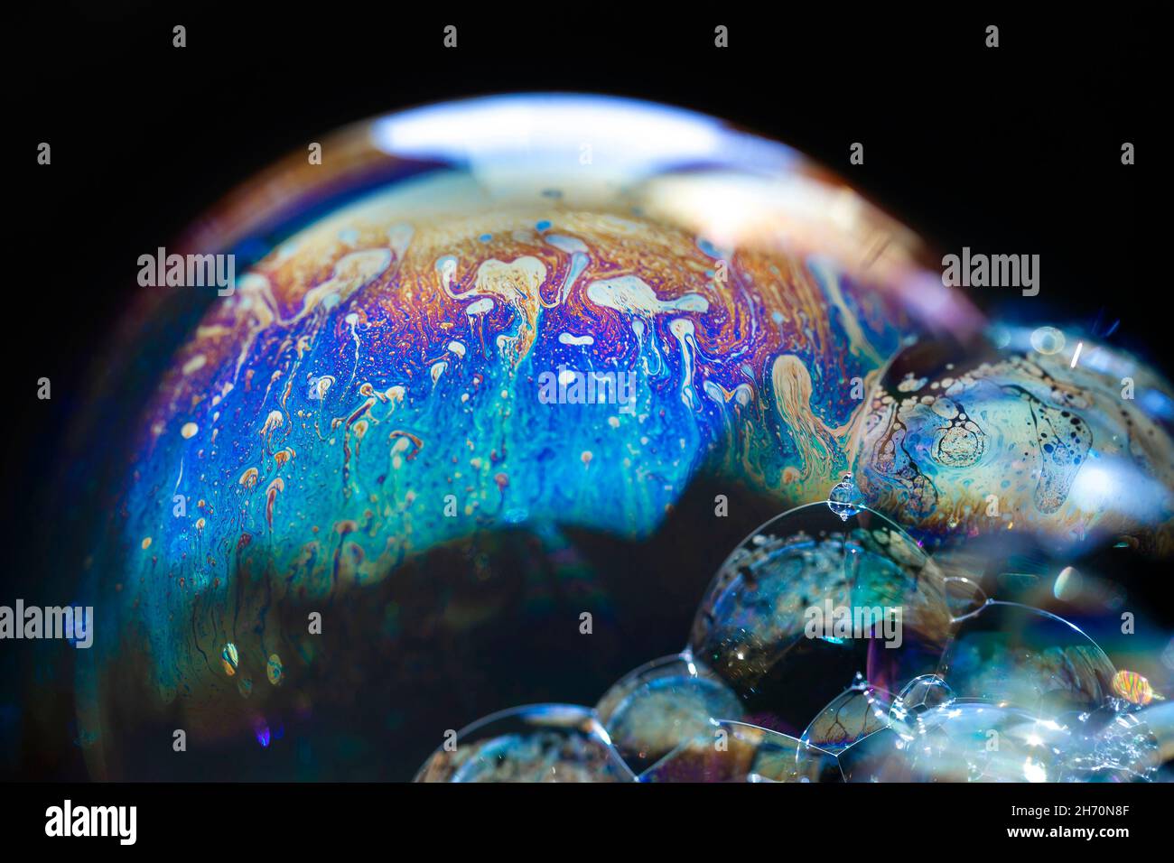 Abstract pattern, multicolored chaotic texture inside of the soap bubble, closeup Stock Photo