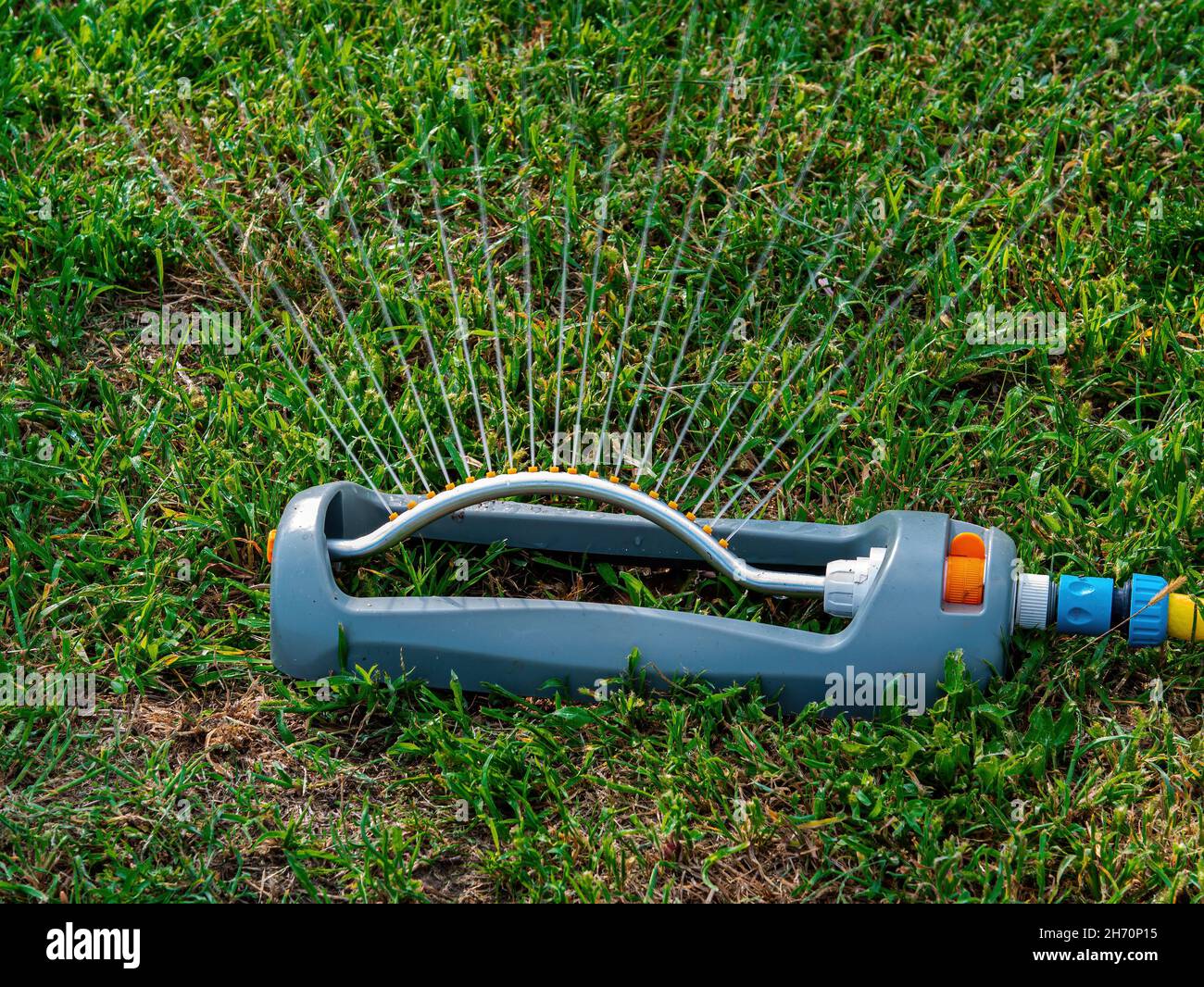 Irrigation system for watering a green grass lawn. Garden equipment