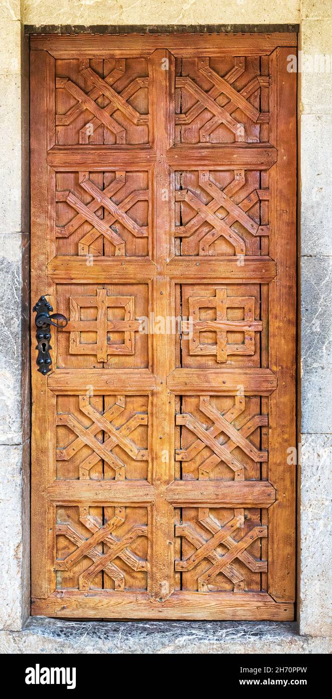 Old brown antique wooden door in a wall built of stone Stock Photo - Alamy