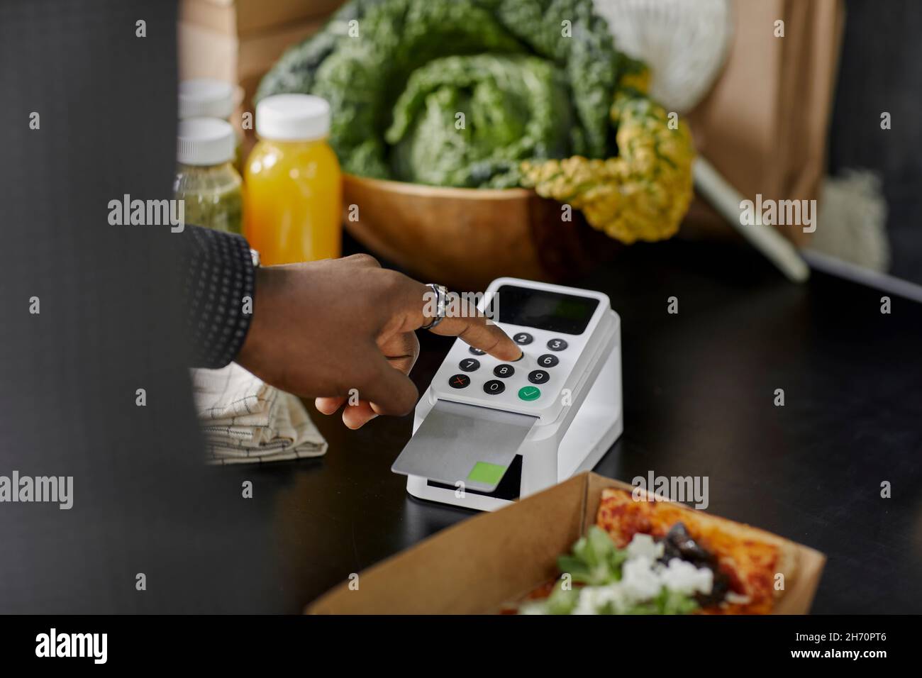 close-up of person using card reader Stock Photo