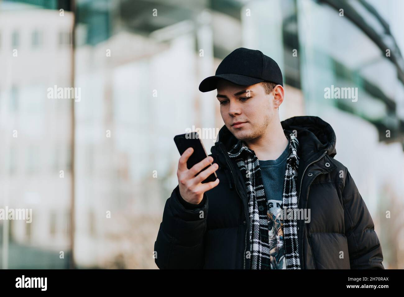 Man looking at his phone Stock Photo