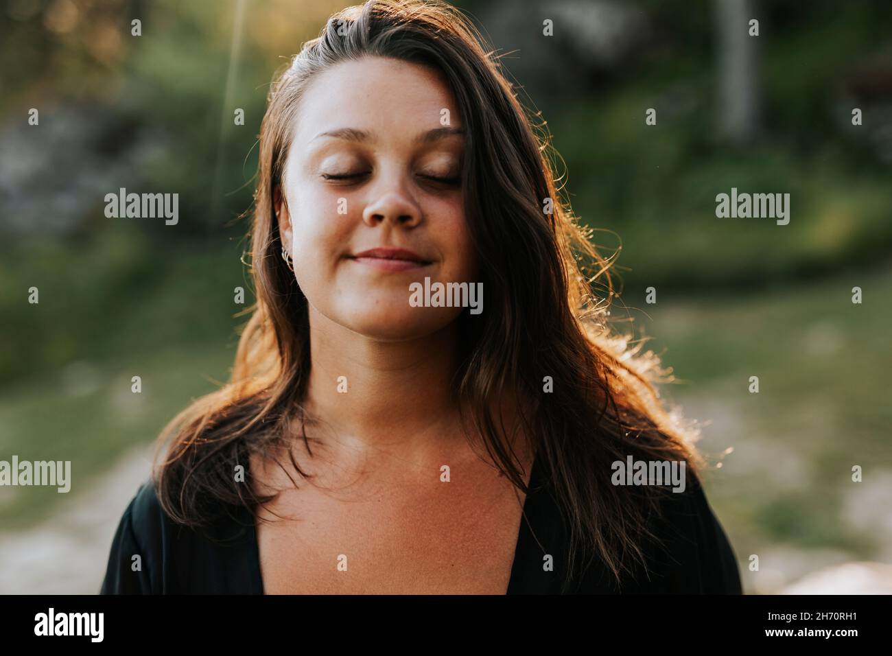 Young woman with closed eyes Stock Photo - Alamy