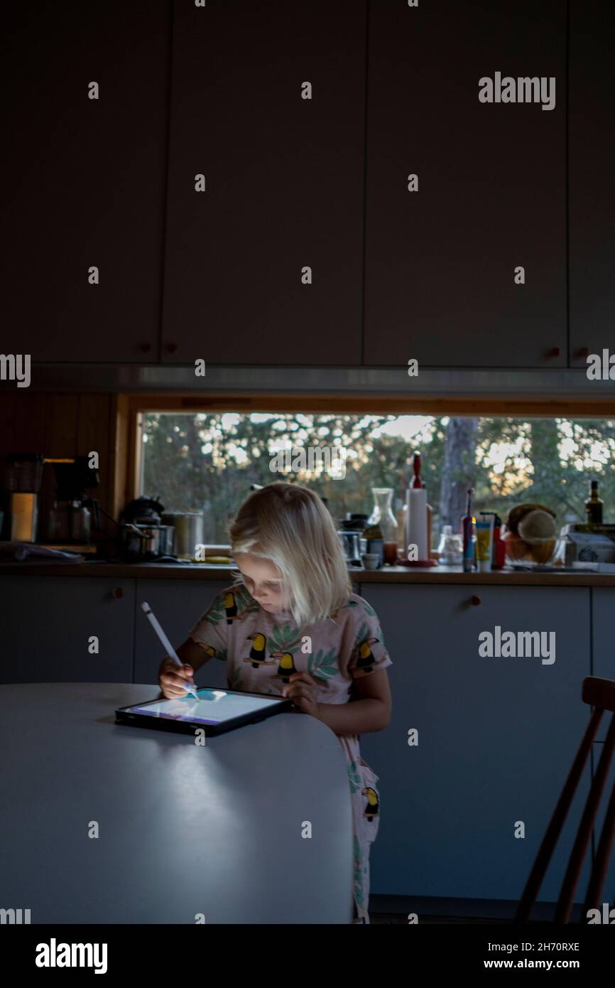 Girl using digital tablet Stock Photo