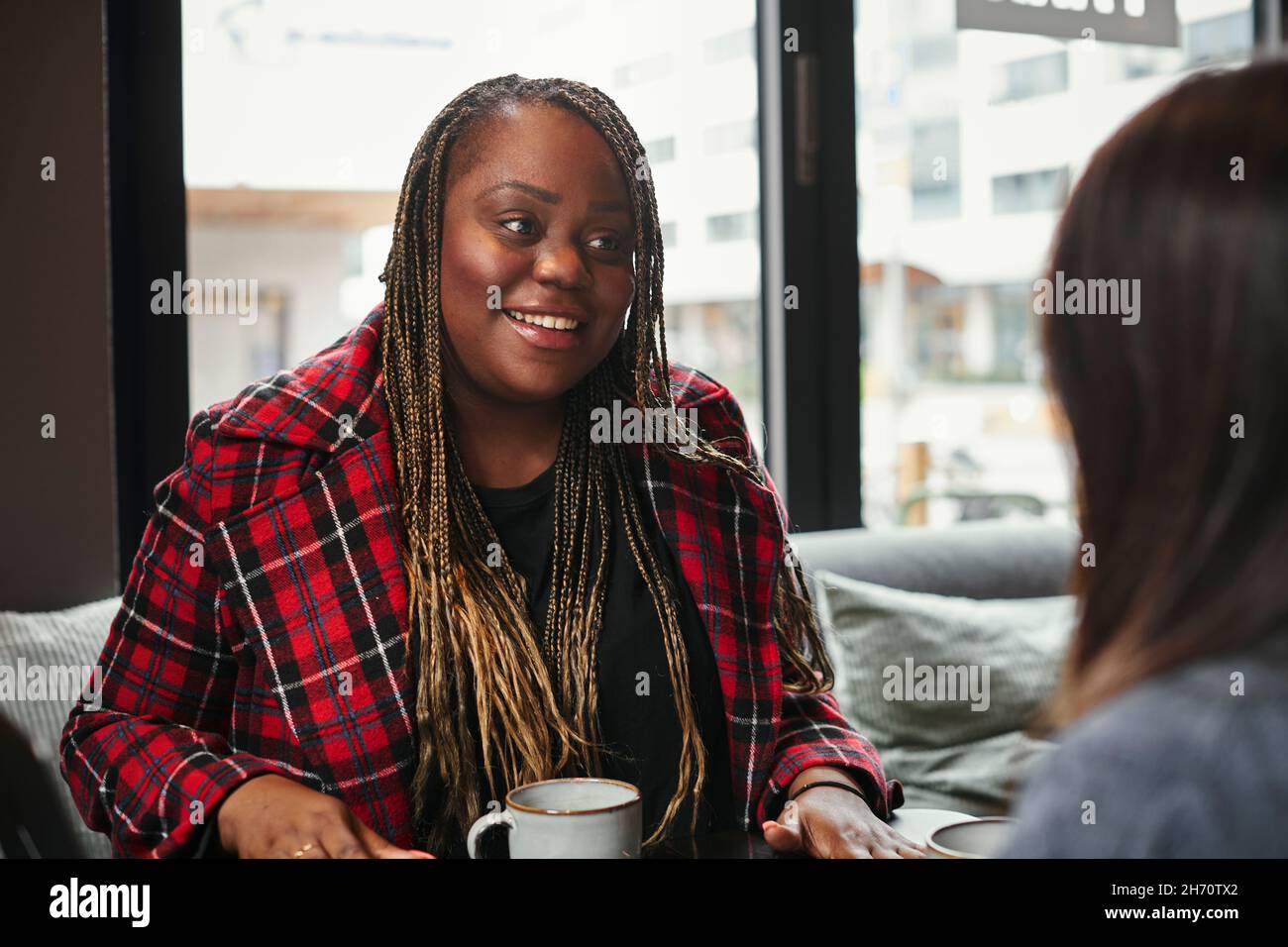 Coworkers talking during coffee break Stock Photo