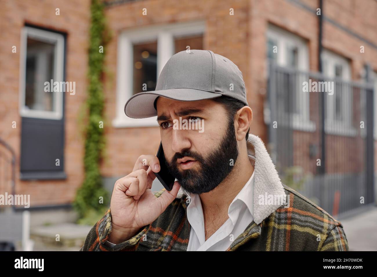 Young man talking on phone Stock Photo