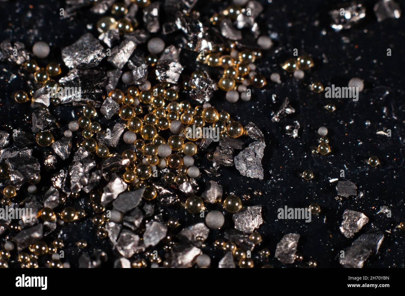Ion exchange resins with activated carbon on a black background close-up, macro photography Stock Photo
