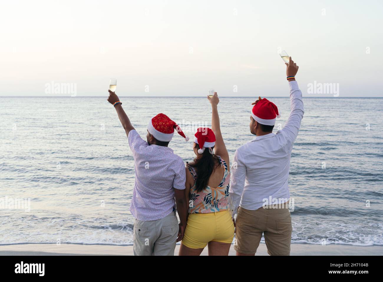 Friends celebrating the New Year's Eve party at the beach. New Year's