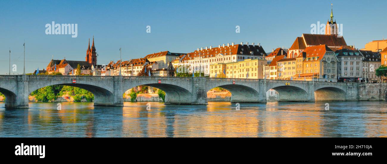 View of the old town of Basel with the Basler Minster, the Martins Church, the bridge Mittlere Bruecke and the river Rhine, Switzerland Stock Photo