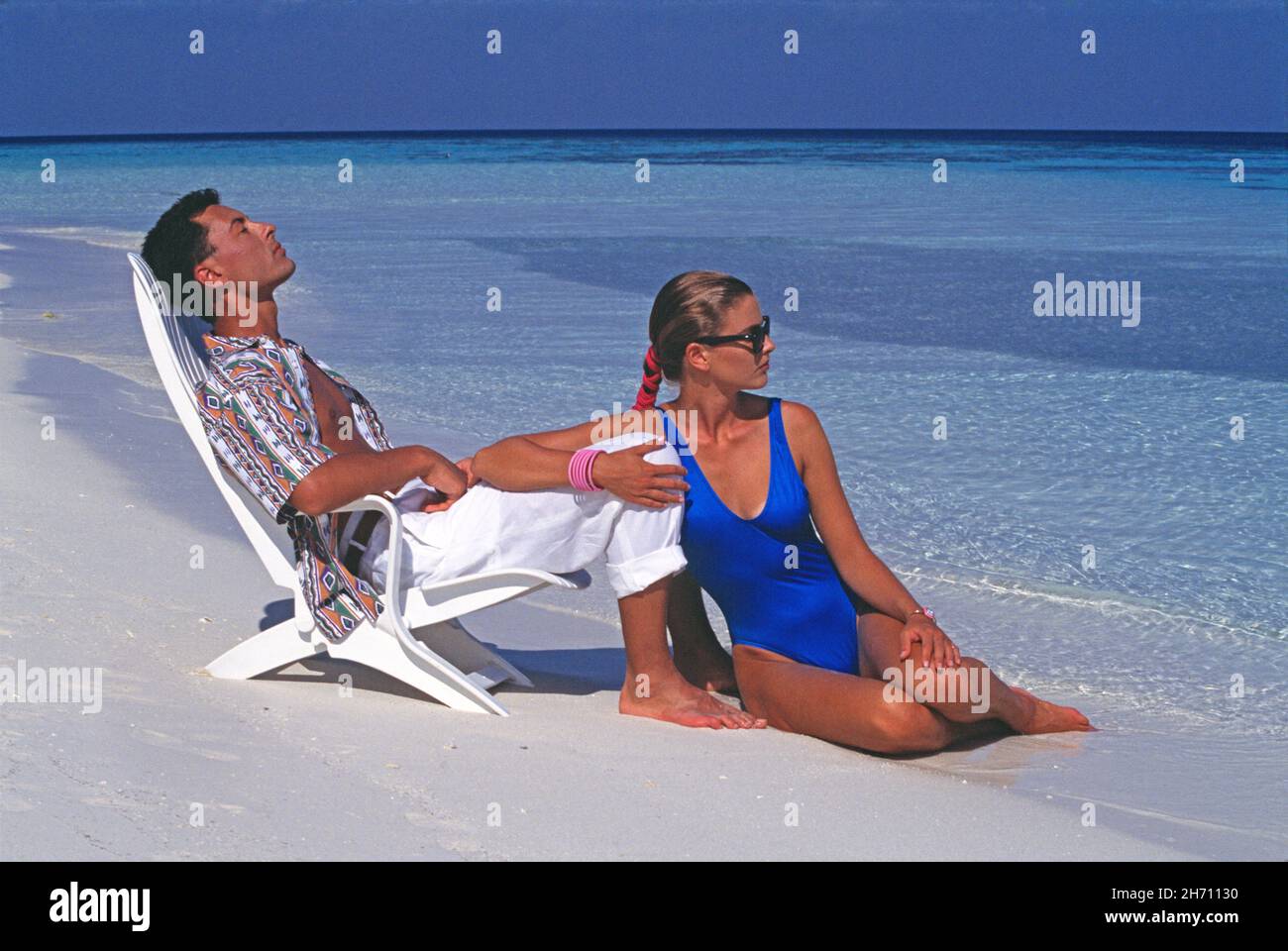 Maldives. Young couple. Man and woman at the beach. Stock Photo