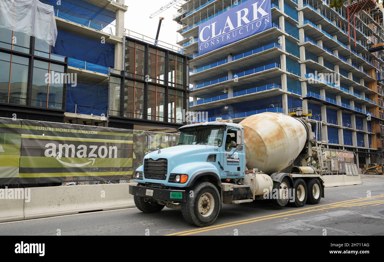A cement mixer passes a work site at Metropolitan Park, the first phase of  new construction of Amazon's HQ2 development, in Arlington, Virginia, U.S.,  October 13, 2021. REUTERS/Kevin Lamarque Stock Photo - Alamy