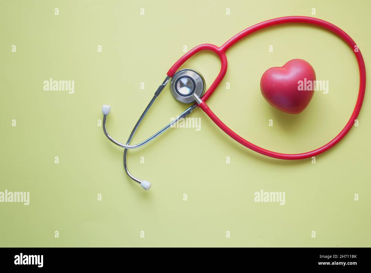 heart shape symbol and stethoscope on white background Stock Photo - Alamy