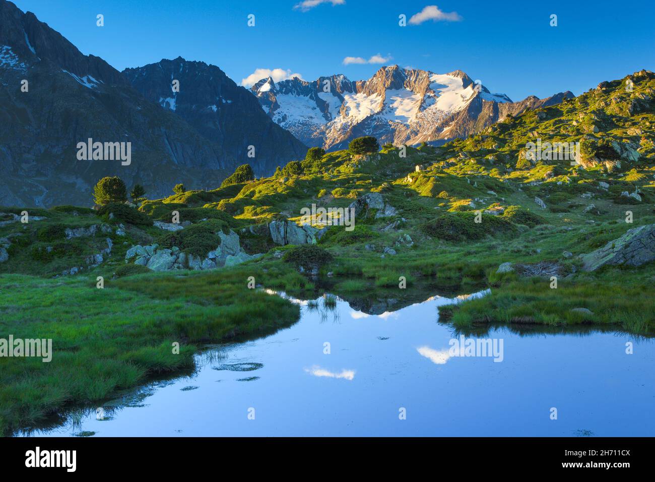 Mountain lake with the mountains Wannenhoerner in background. Valais, Switzerland Stock Photo