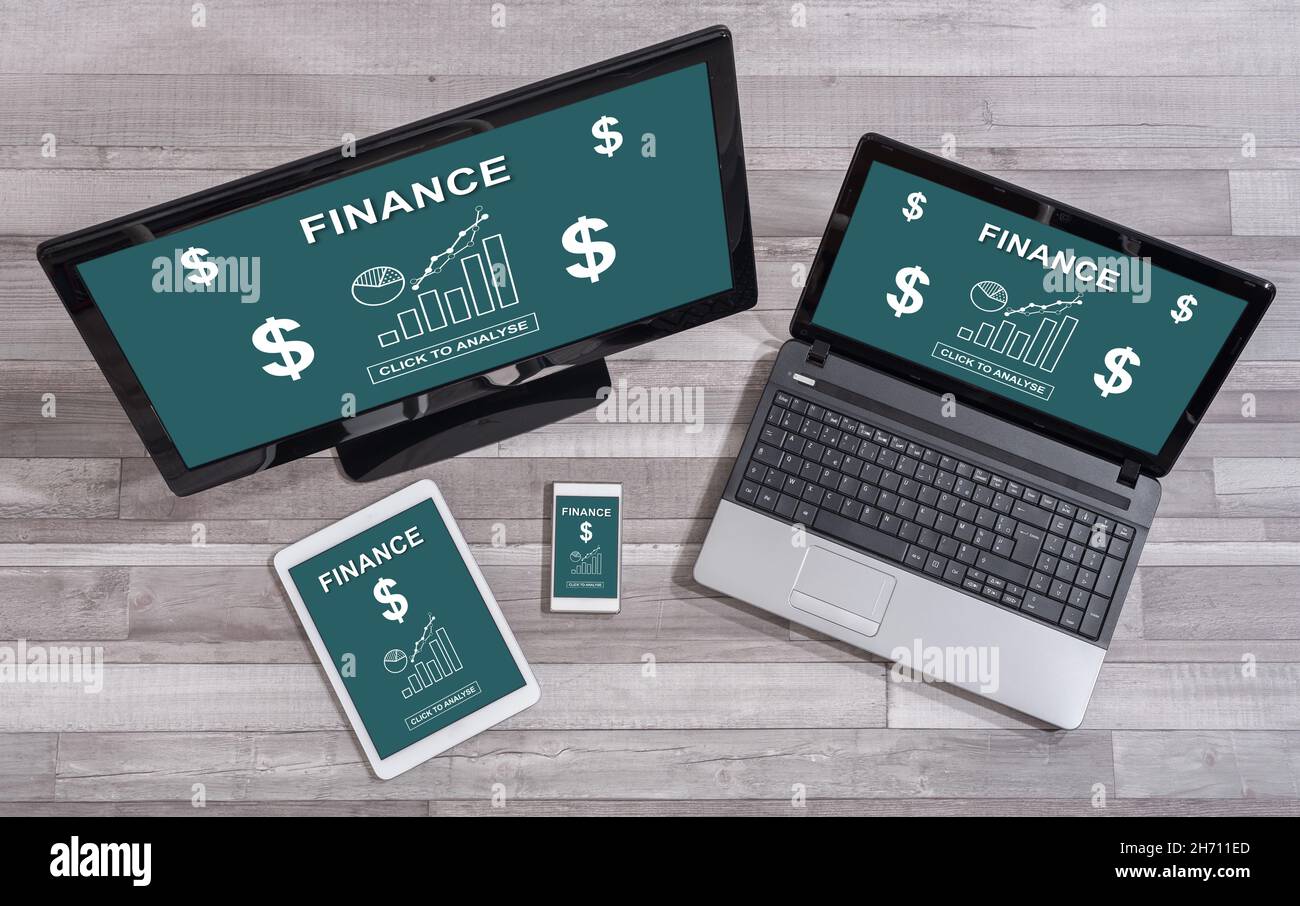 Finance concept shown on different information technology devices Stock Photo