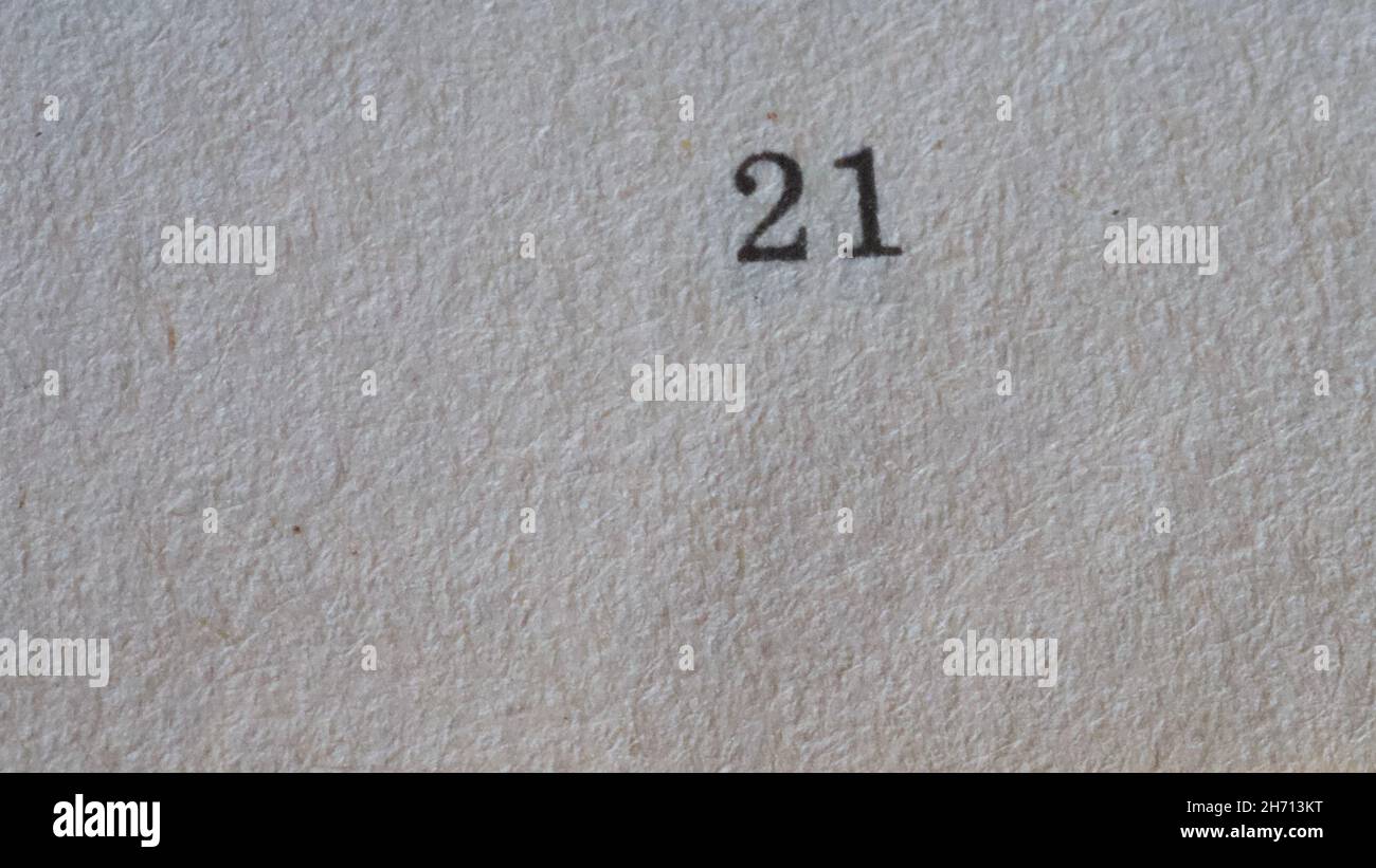 The number 21 printed on a piece of paper. Paper texture. Stock Photo