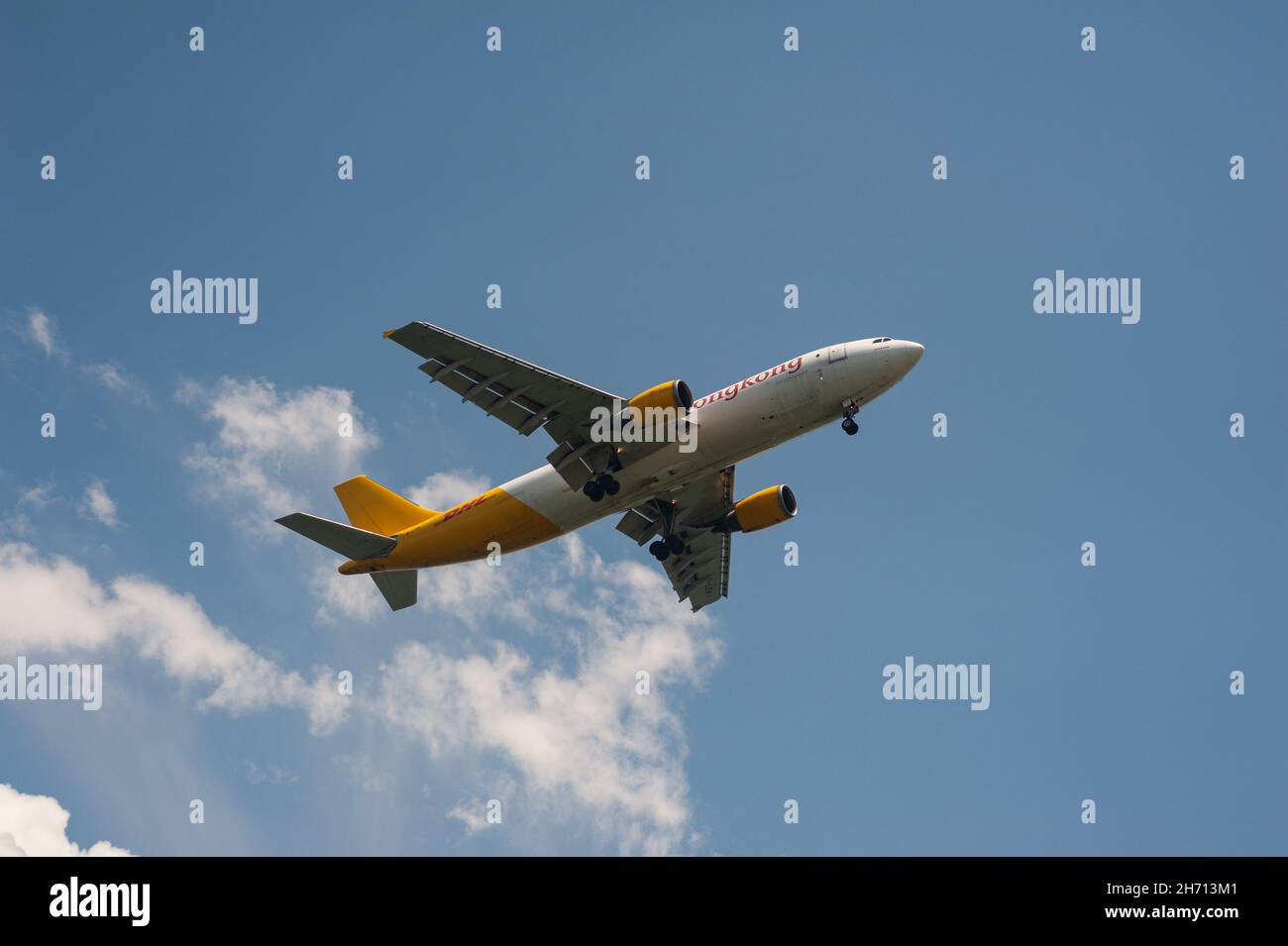 16.11.2021, Singapore, Republic of Singapore, Asia - DHL airline Airbus A300-600F cargo aircraft operated by Air Hong Kong approaches Changi Airport. Stock Photo