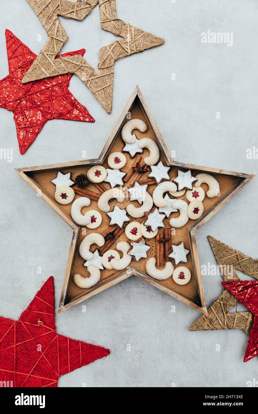 Swiss Christmas cookies arranged in a wooden starshaped form on white