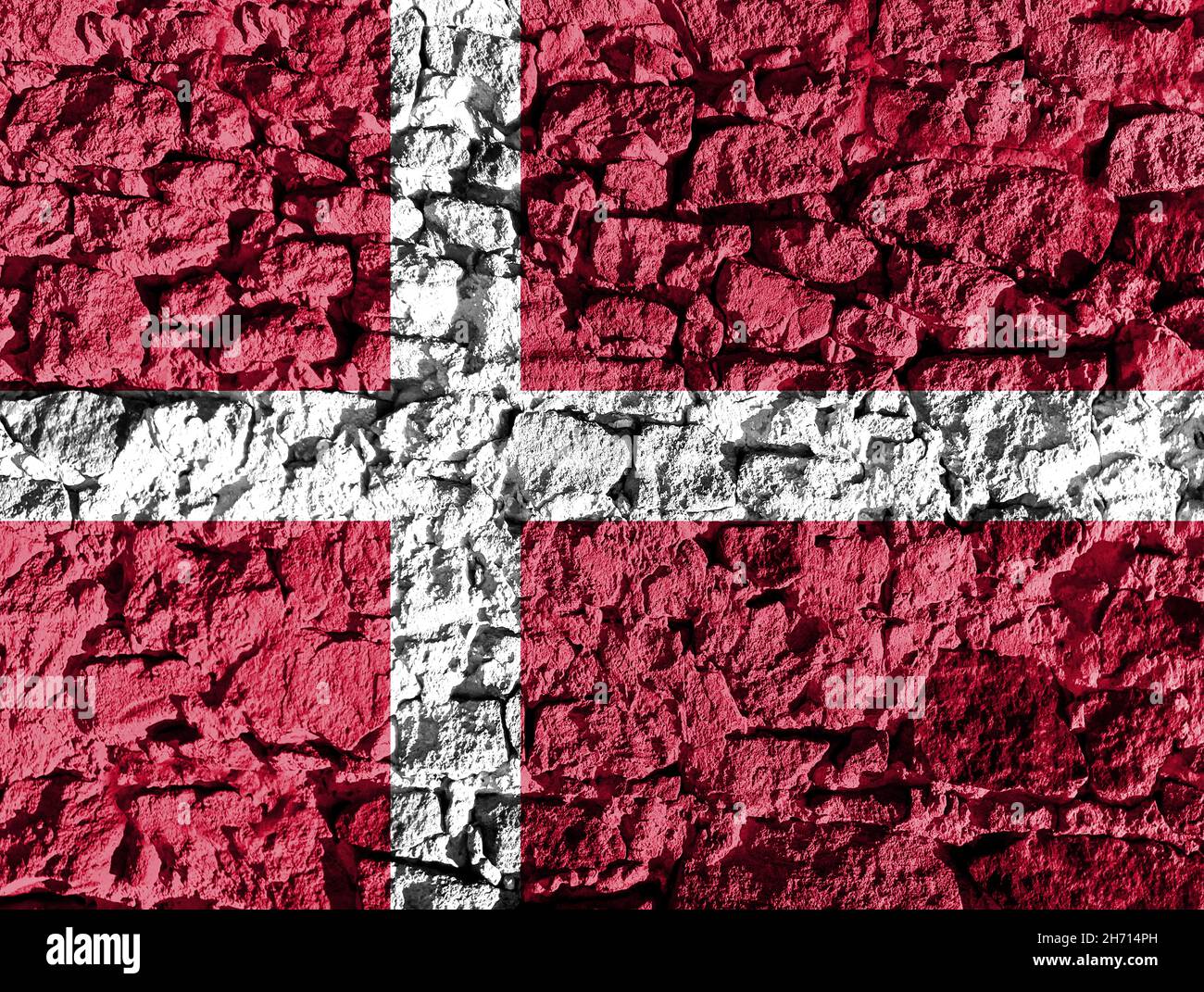 Denmark flag depicted on a stone wall. The texture of the stone blends ...