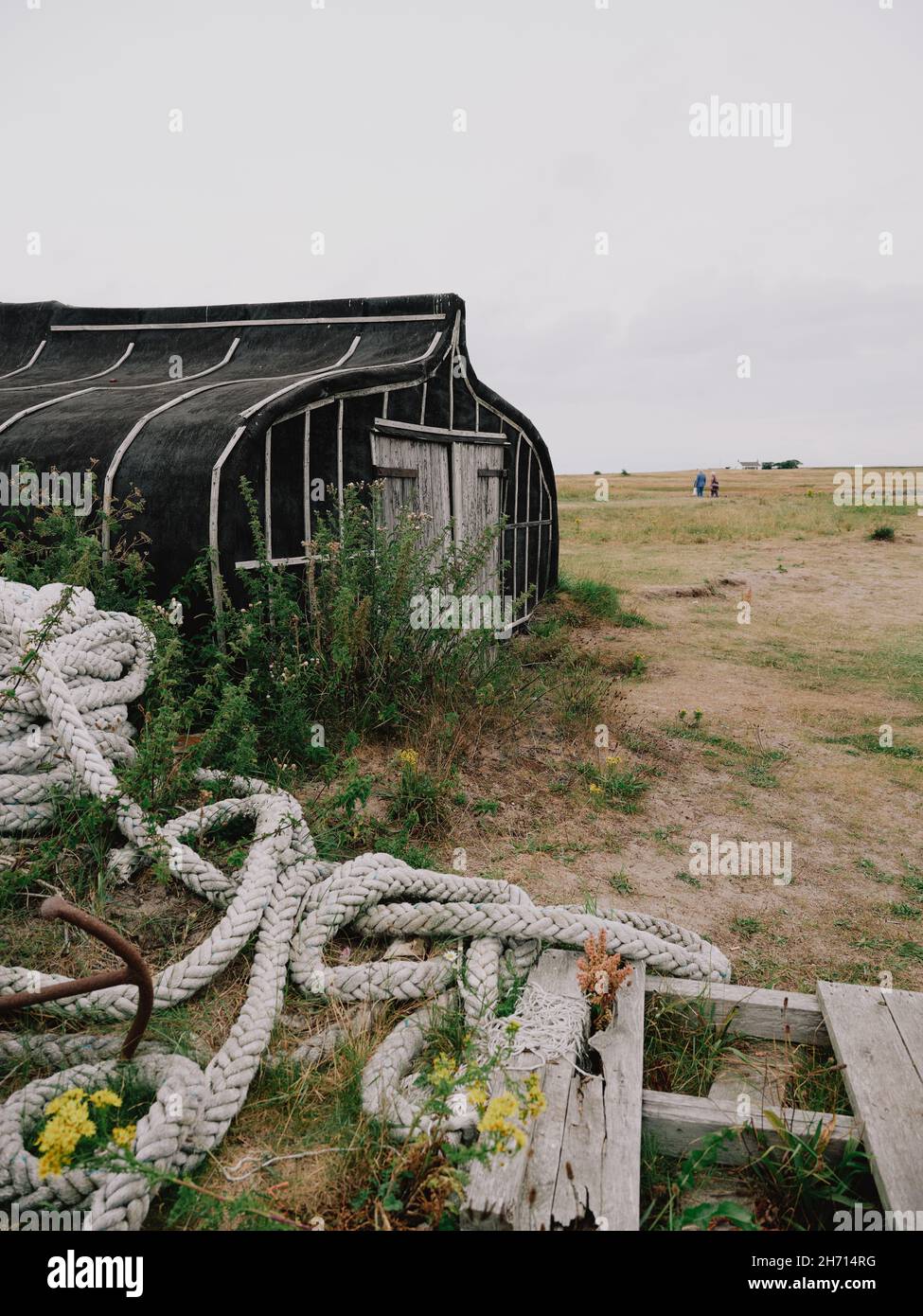 The upturned Herring fishing boat hulls used as sheds or huts on Holy ...