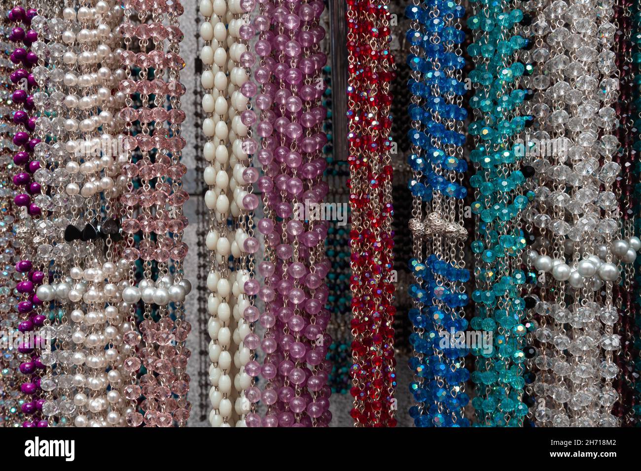 Colorful rosaries in a souvenir and devotional shop in Lourdes, France Stock Photo