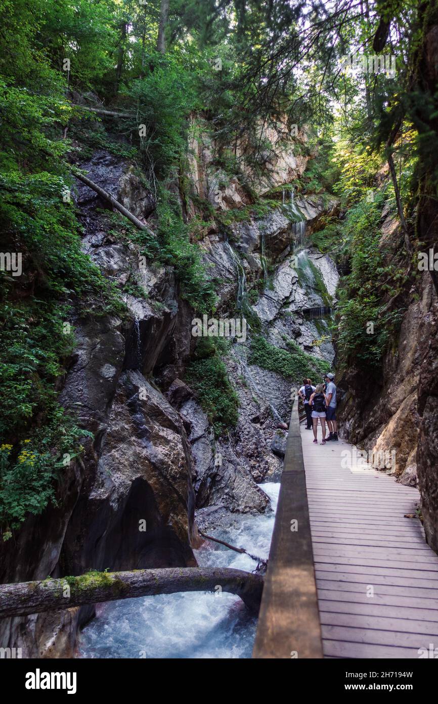 RAMSAU, GERMANY - Aug 26, 2020: A narrow elevated walkway with tourists ...