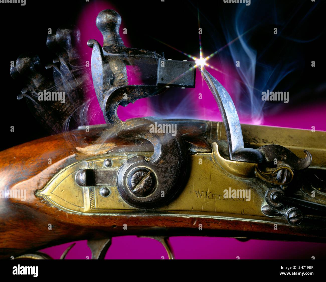 Close up of firing mechanism of Flintlock pistol & microchip as a flint on graduated purple