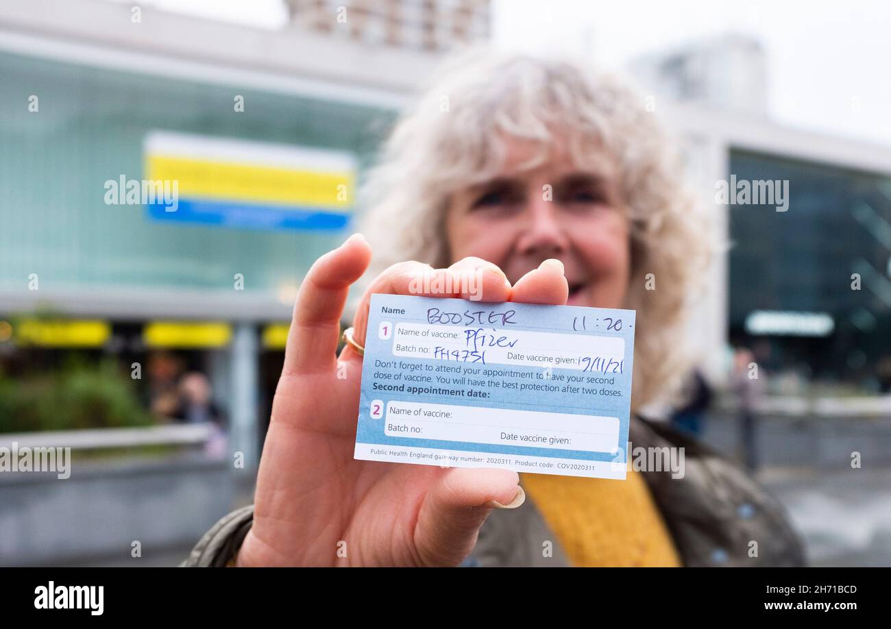 Brighton UK 19th November 2021 - Jennifer is happy after receiving her Pfizer booster jab  in Brighton today as the UK continues with its vaccination programme to combat the COVID-19 coronavirus : Credit Simon Dack / Alamy Live News Stock Photo