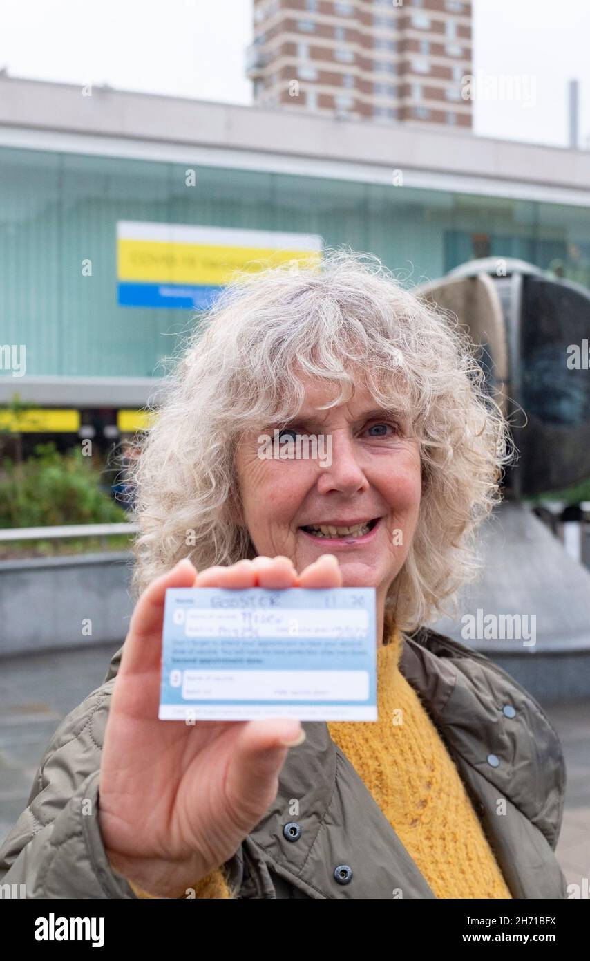Brighton UK 19th November 2021 - Jennifer is happy after receiving her Pfizer booster jab  in Brighton today as the UK continues with its vaccination programme to combat the COVID-19 coronavirus : Credit Simon Dack / Alamy Live News Stock Photo