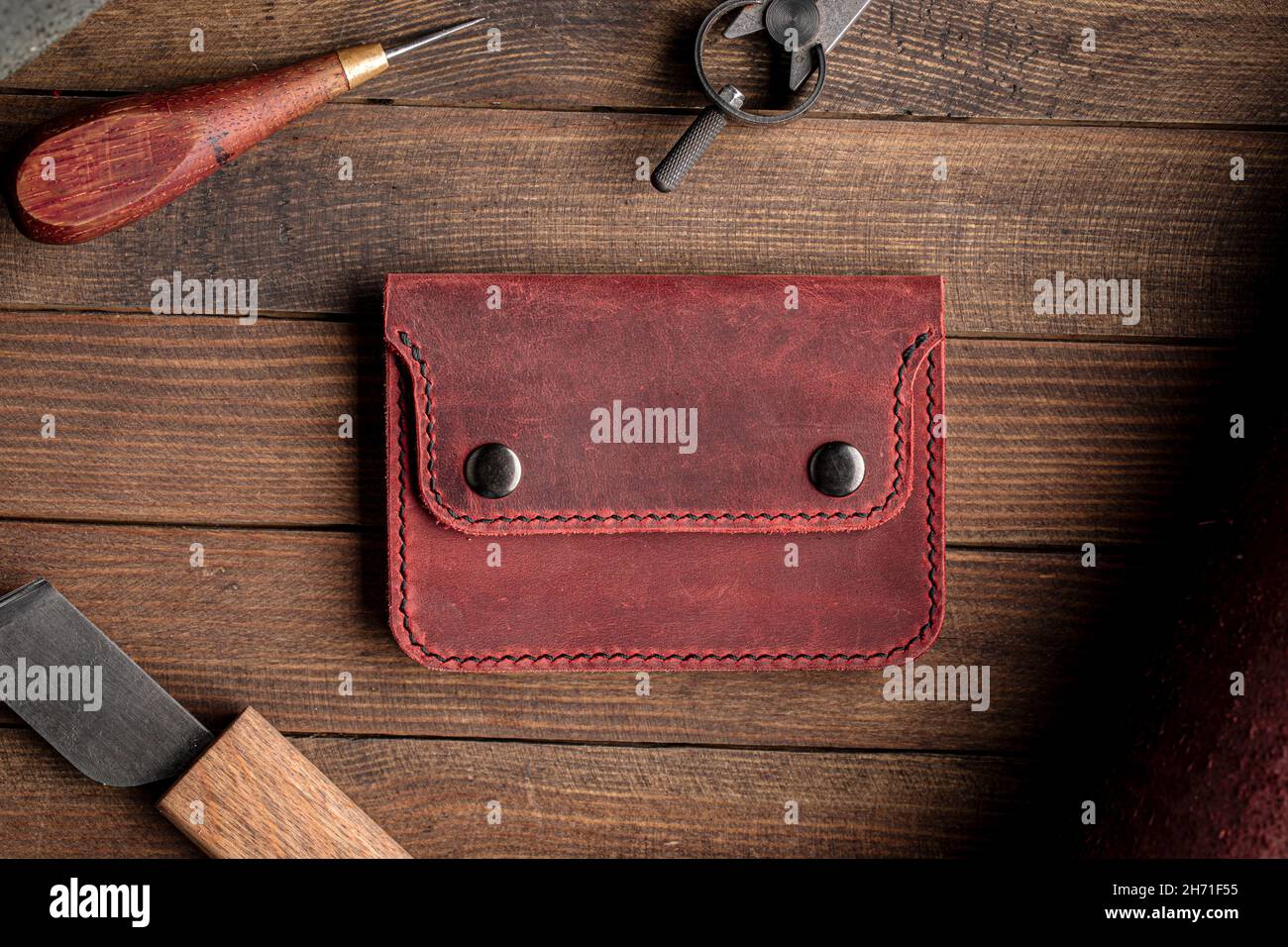 Top view on hand crafted red leather wallet Stock Photo