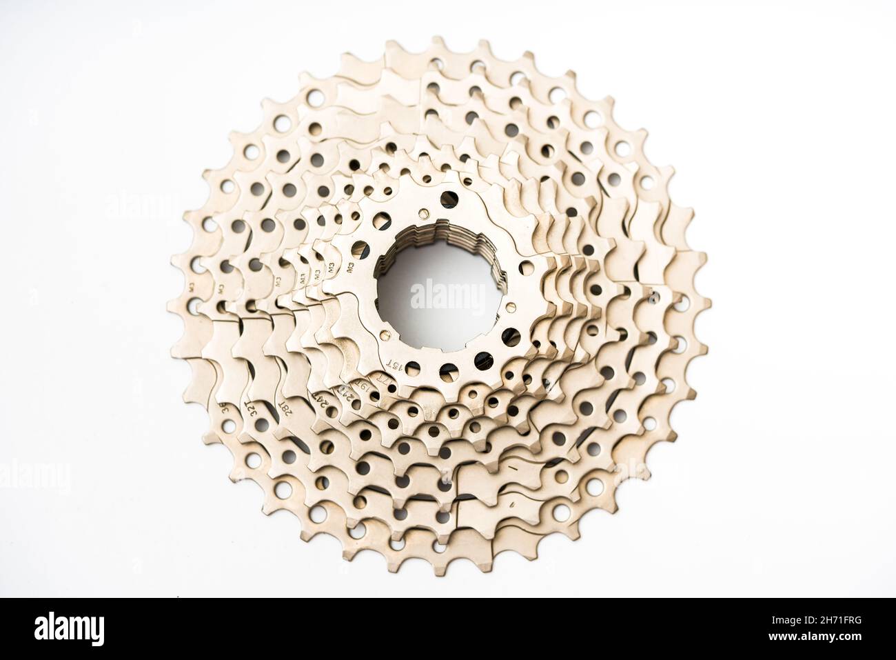 Gears, sprockets and chain of a mountain sports bike on a white