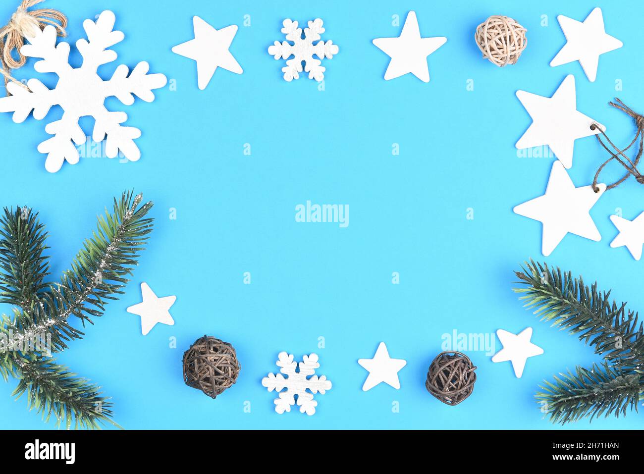 Christmas holiday flat lay miminal composition with copy space in white and pale blue theme. Stock Photo
